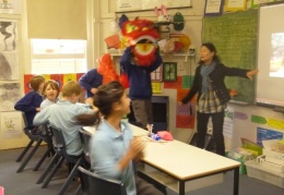 Year 5 and 6 students playing acting lion dance
