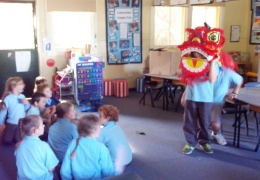 Year 3 students take turns doing the lion dance