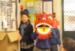 Year 5 and 6 students playing acting lion dance
