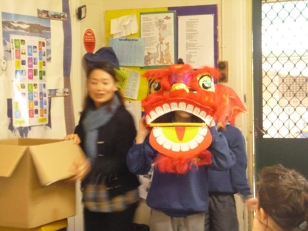 Year 5 and 6 students playing acting lion dance