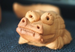 small clay crocodiles with wide eyes