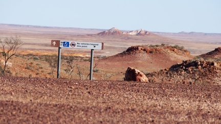 Just a short distance north of Coober Pedy lies The Breakaways, from the back loop the drive passes the dog fence and Moon Plain